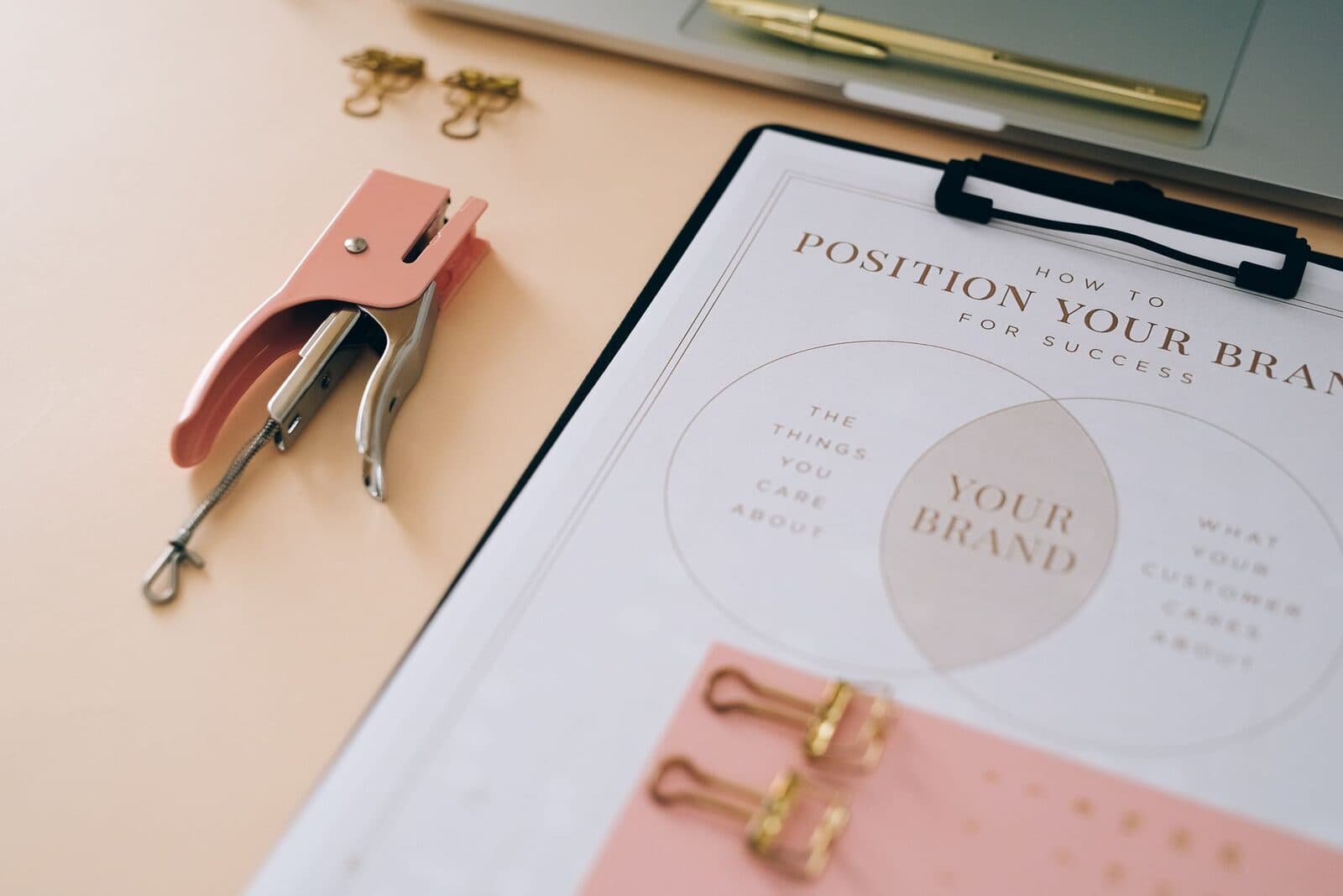 Designer working on brand materials at a studio desk