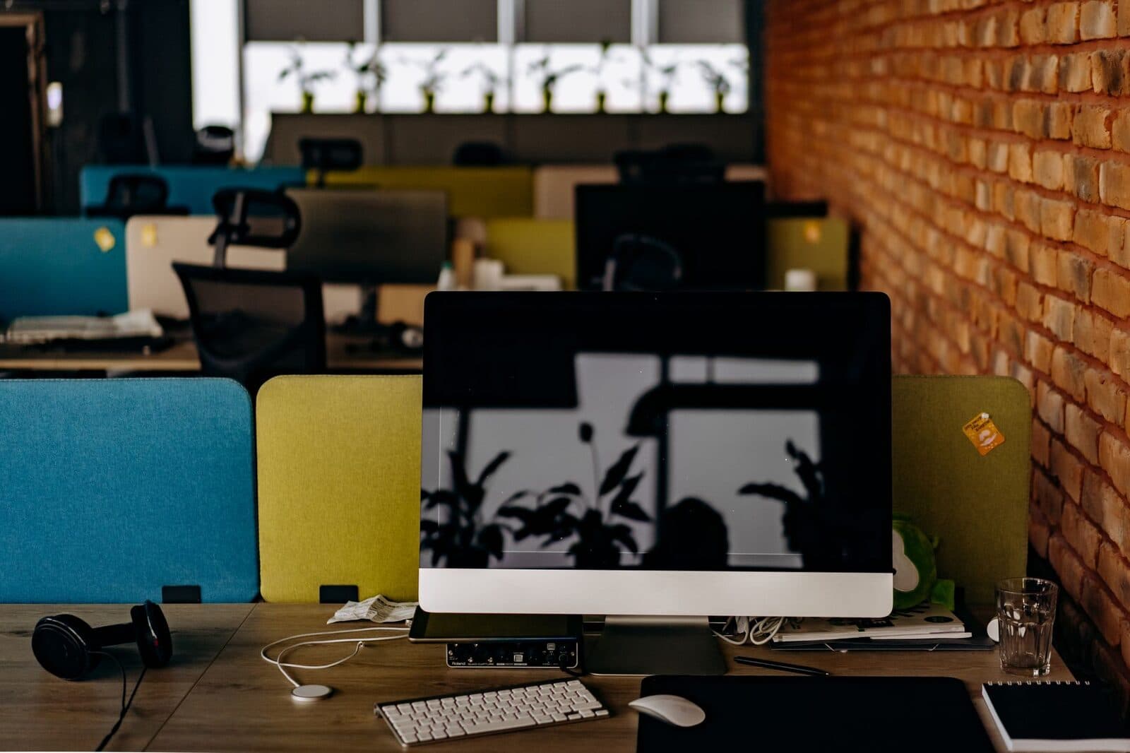 Modern agency workspace with people at computers
