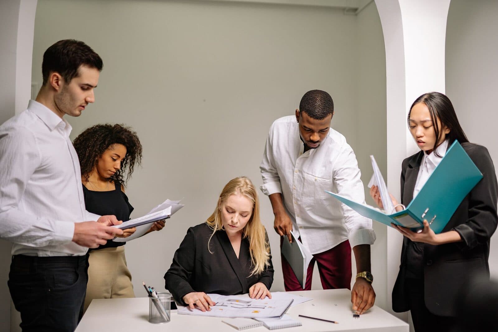 Reputation management team working together in an office