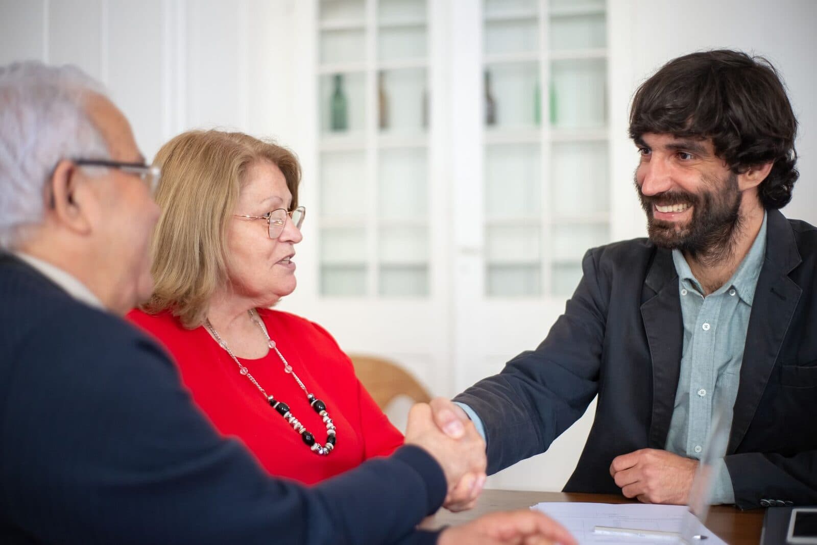 Consultant meeting with a client across a table