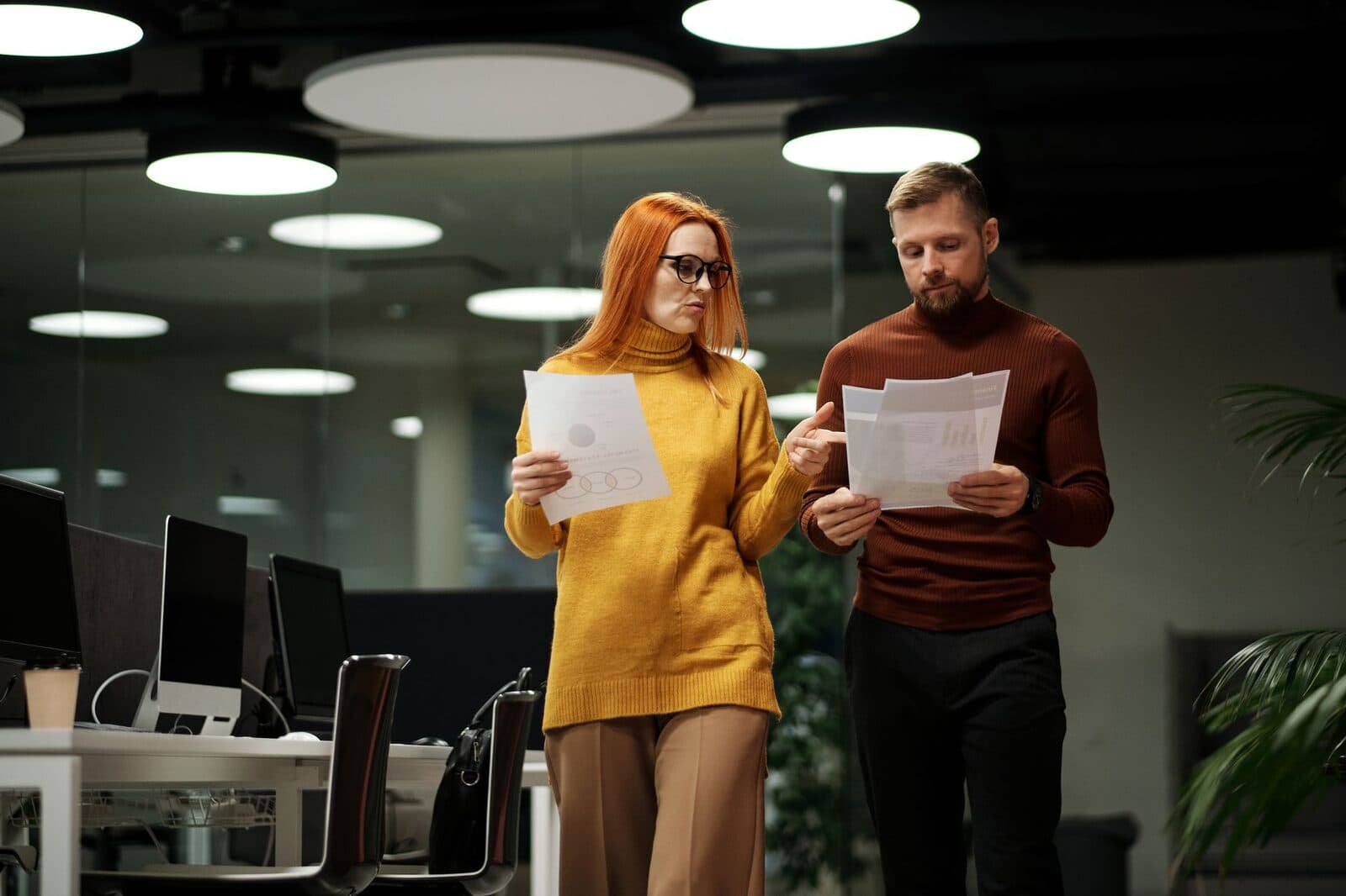 Two professionals reviewing a strategy document together